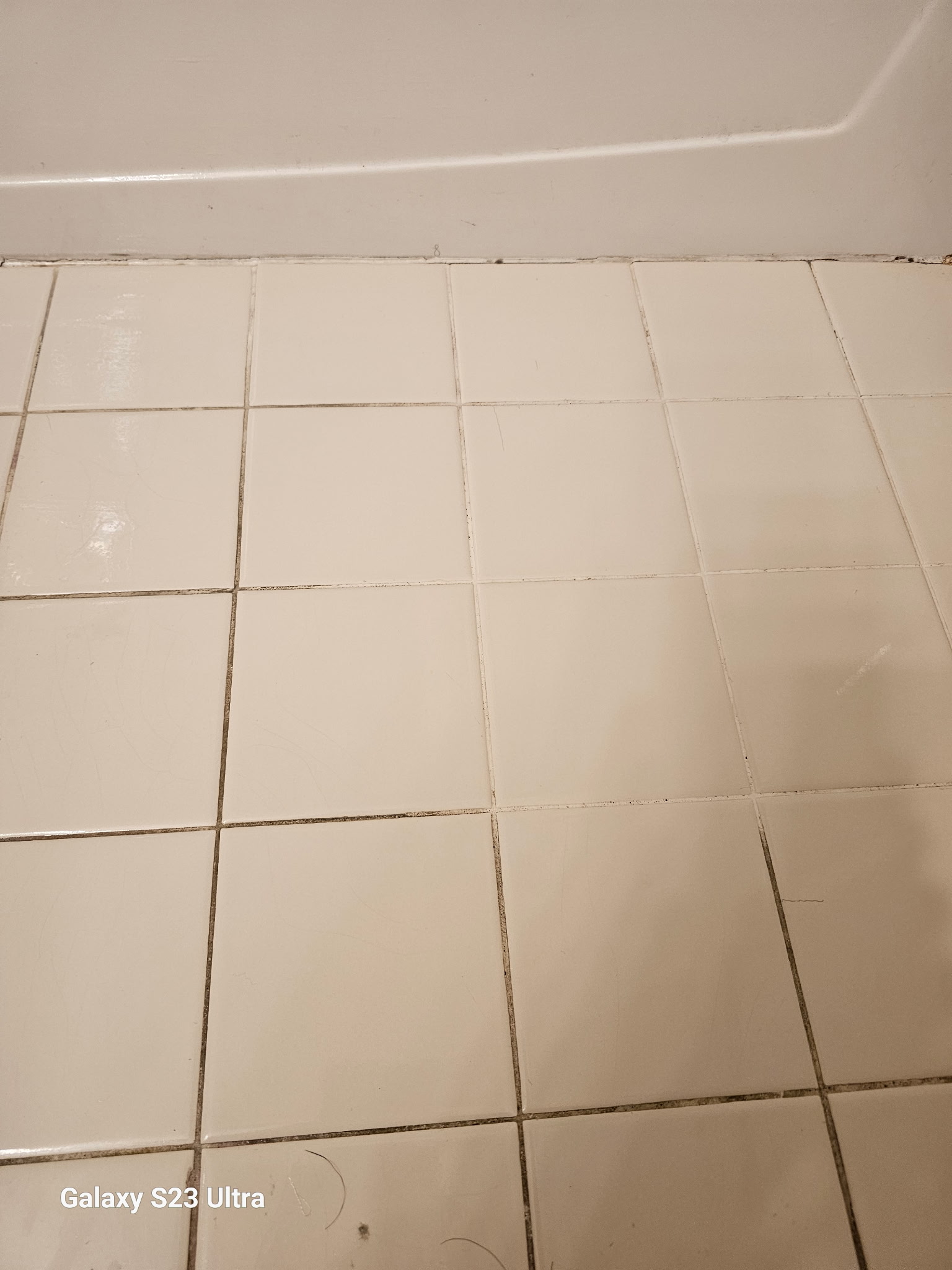 Residential tile floor near a bathtub